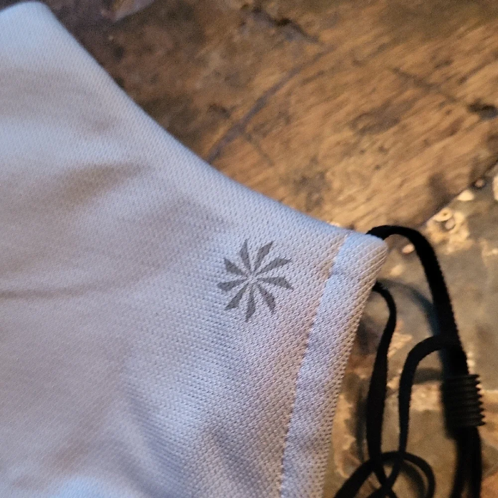 Athleta light gray face mask with black ear loops